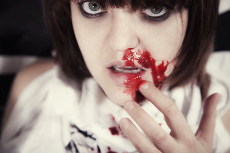 Portrait of  young woman with  bloodstained faceの写真素材