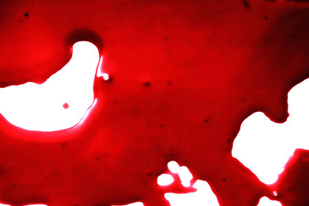spot of red blood on white close upの写真素材