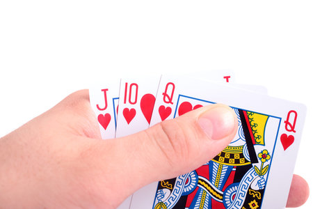 Hand and playing cards isolated on white backgroundのeditorial素材