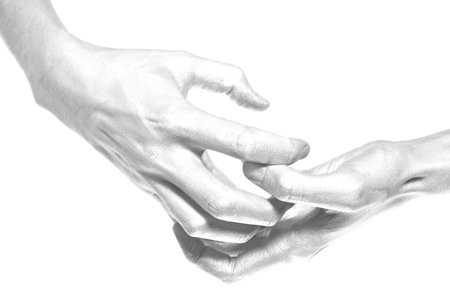 beautiful male hands in silver paint on a white background