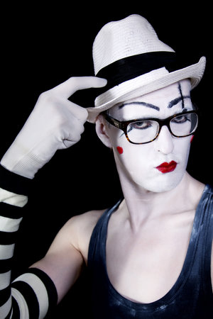 Portrait of Mime in white hat glasses and gloves closeupの写真素材