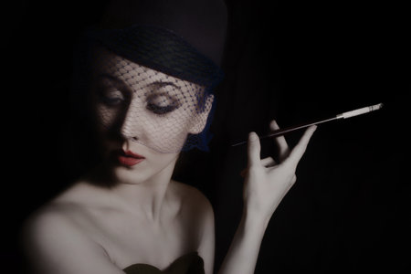 Retro portrait of beautiful young caucasian woman in veil with cigarette