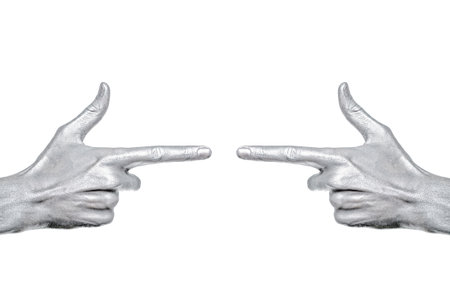 man's hand with index finger in a silvery paint isolated on white backgroundの写真素材