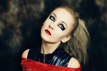 Portrait of beautiful young woman with bright makeup closeup