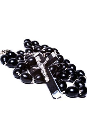 Catholic rosary with a crucifix isolated on white background closeupの写真素材