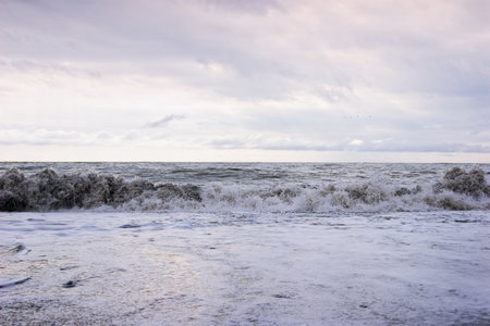 Ocean waves on a sandy beachの写真素材