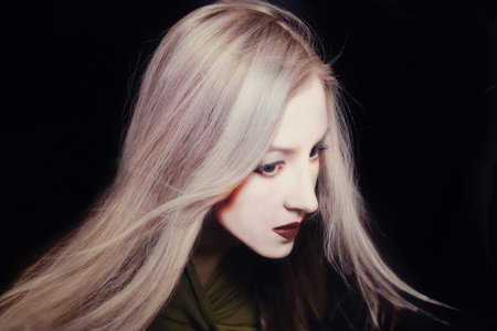 Portrait of a beautiful young woman with white make-up simulating a Japanese dollの写真素材