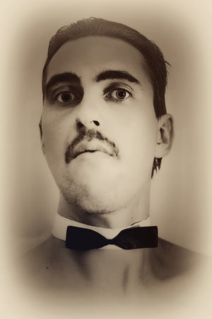 Retro portrait of a young man in a bowtie closeup