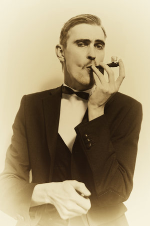 retro portrait of adult man smoking pipe closeup