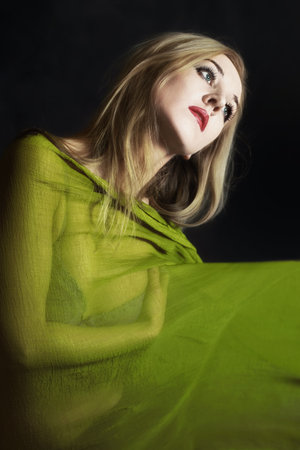 beautiful young woman in green summer dress close upの写真素材