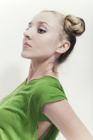 Portrait of a young woman with stylish hairstyle on a white backgroundの写真素材