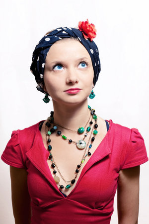 beautiful young woman in headscarf on white background