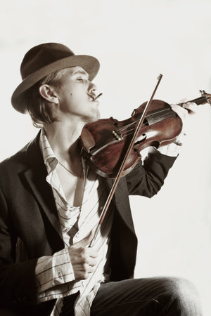 young violinist playing to violin close up
