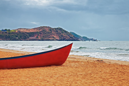 Red boat on a sandy beach. hdrの写真素材