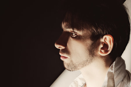 Studio portrait of young beautiful unshaven men closeupの写真素材
