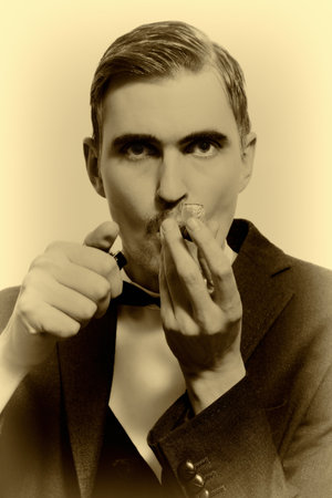 retro portrait of adult man smoking pipe closeupの写真素材
