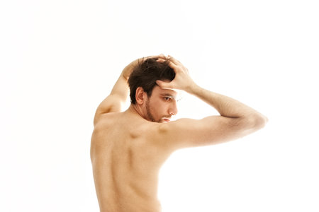 Young bared dancing man on a white backgroundの写真素材