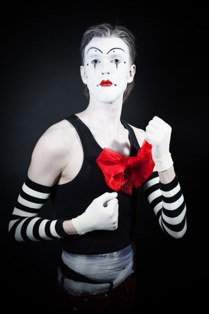 Funny mime on a black backgroundの写真素材