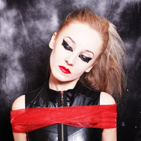 Square portrait of young woman with bright gothic makeup closeupの写真素材