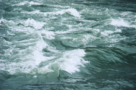 River water with turbulent flow close up