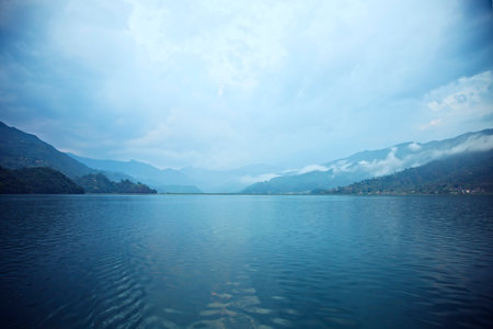 Morning landscape with lake and mountains in Pokhara, Nepalの写真素材