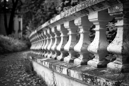 Old stone balustrade in the park closeup