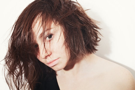 Portrait of a beautiful young woman on white backgroundの写真素材