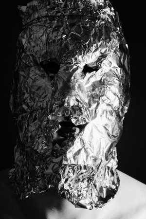 Portrait of a man dressed in scary masks foilの写真素材