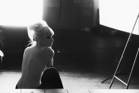 Photo of a beautiful young nude model in the studioの写真素材