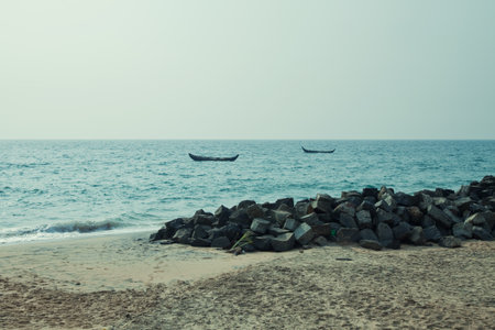 Sandy beach and boat in the seaの写真素材