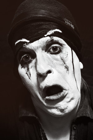 Theatrical actor with dark makeup on her faceの写真素材