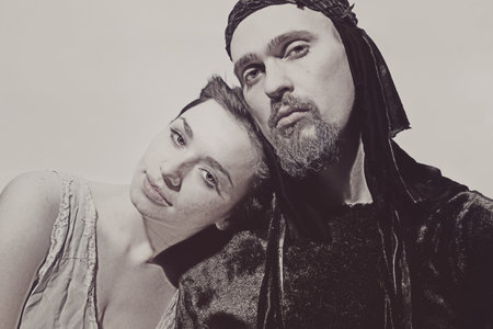 Portrait of young man and woman on a white backgroundの写真素材