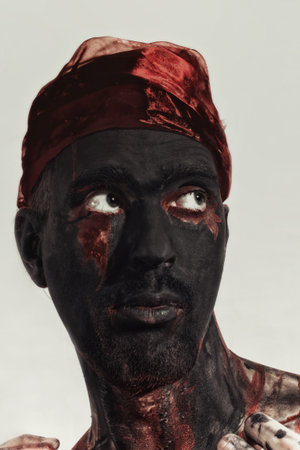 Portrait of Man with black theatrical make-upの写真素材