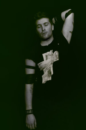 Portrait of a young handsome man on a black background