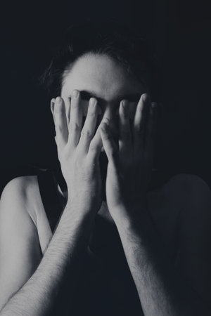 Strange portrait of a young man close upの写真素材