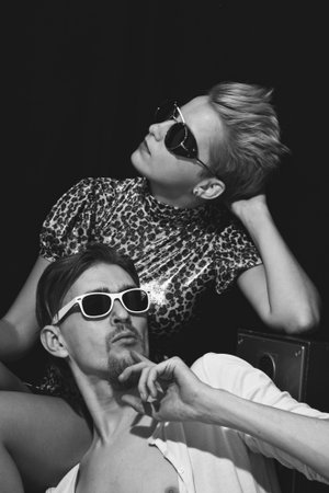 Portrait of stylish men and women on a black backgroundの写真素材