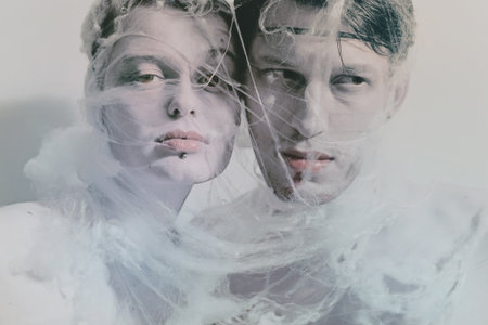 Portrait of young lovers entangled web of closeupの写真素材