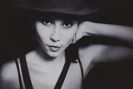 Portrait of a young Asian woman in a hat closeup