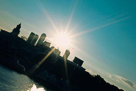 City landscape with silhouettes of buildings at sunsetの写真素材