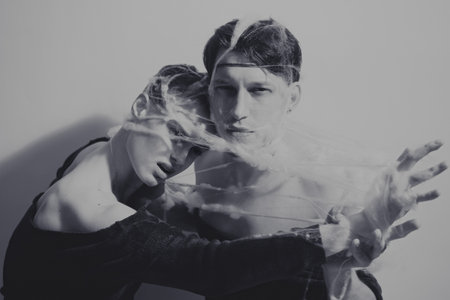 Portrait of young lovers entangled web of closeup
