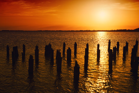 Landscape with beautiful sunset over the lakeの写真素材