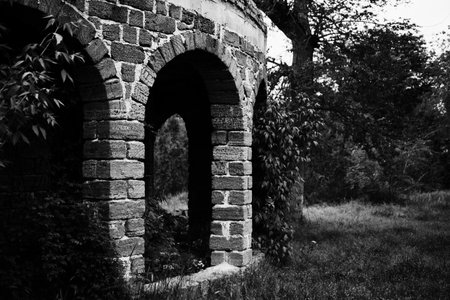 Old stone ruined gazebo in the summer parkの写真素材