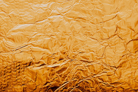The texture of shiny Golden foil close up