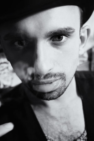 Portrait of  handsome young man wearing hat