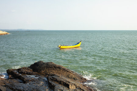 Empty small fishing boat on the seaの写真素材