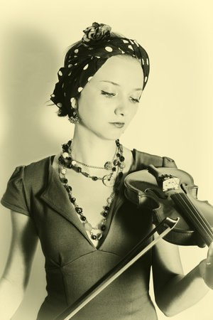 Retro portrait of young woman with violin