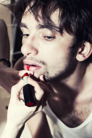 Man with red lipstick on her lips. Makeupの写真素材