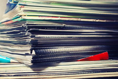 Large stack of magazines on table close-upの写真素材