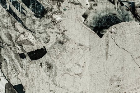 Texture of concrete wall with scraps of paperの写真素材