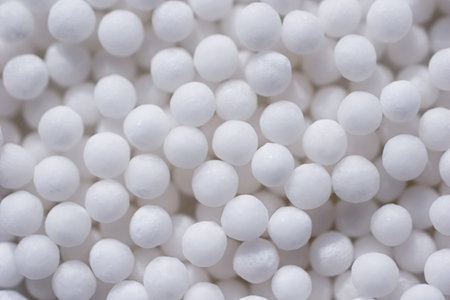 Background with spherical homeopathic pills closeup